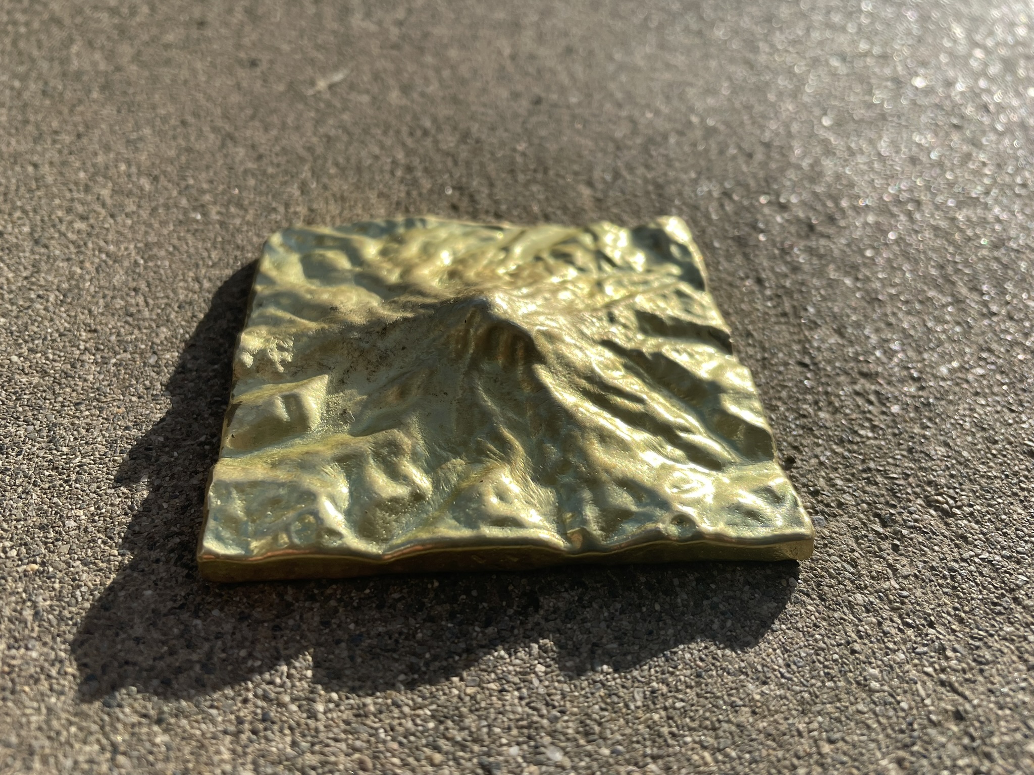 A cast brass sculpture of Mount Rainier